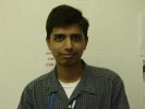 A photo of a not so happy Vishal as he works as a Lab Aide in the computer lab