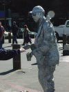 These perfomers stood on crates with music playing.  They moved torwards people with their donation cups out.
