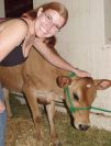 Harmony pets a baby cow